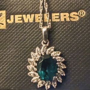 Simulated emerald and diamond sterling silver necklace.